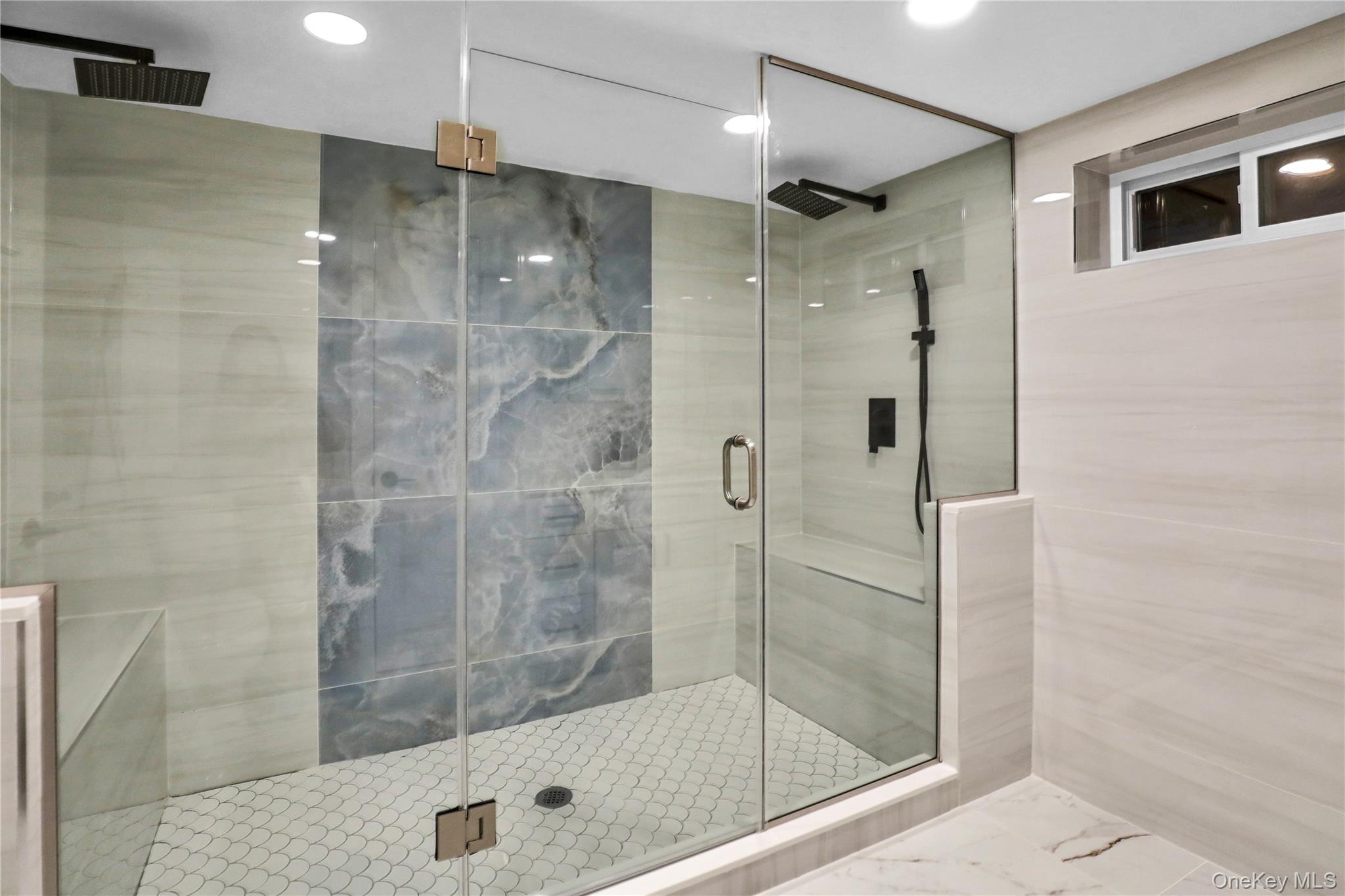 45 Colony Lane Syosset, NY 11791 - Photo 20 of 23 a bathroom with a shower a toilet and a sink
