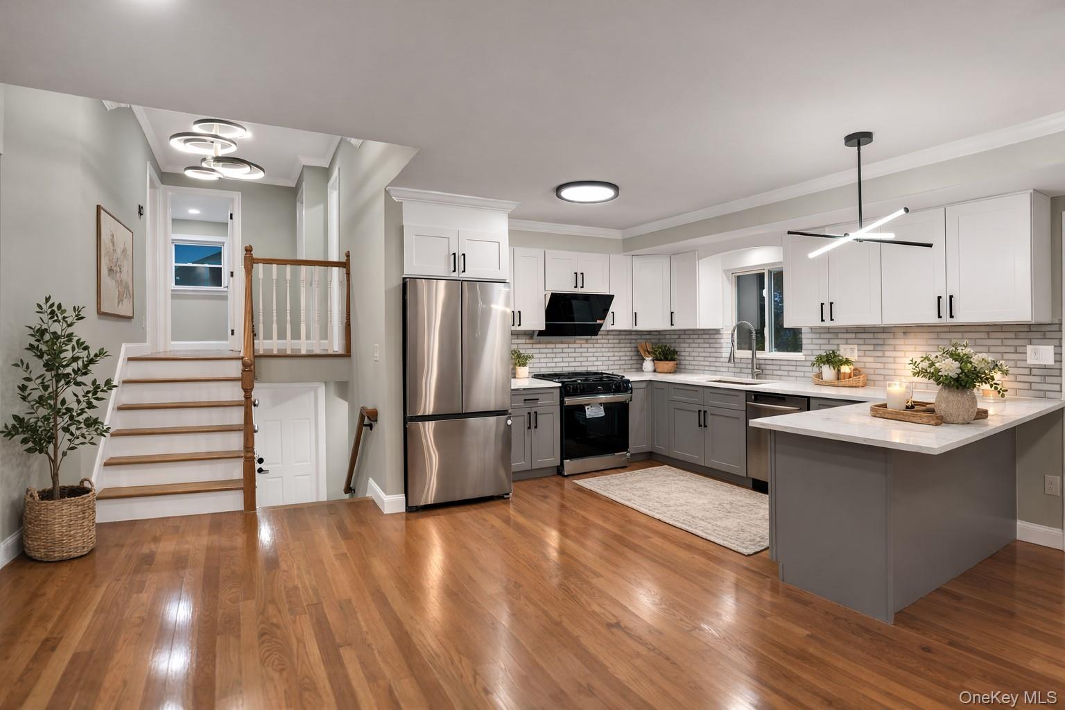 45 Colony Lane Syosset, NY 11791 - Photo 4 of 23 a kitchen with stainless steel appliances a refrigerator sink and cabinets