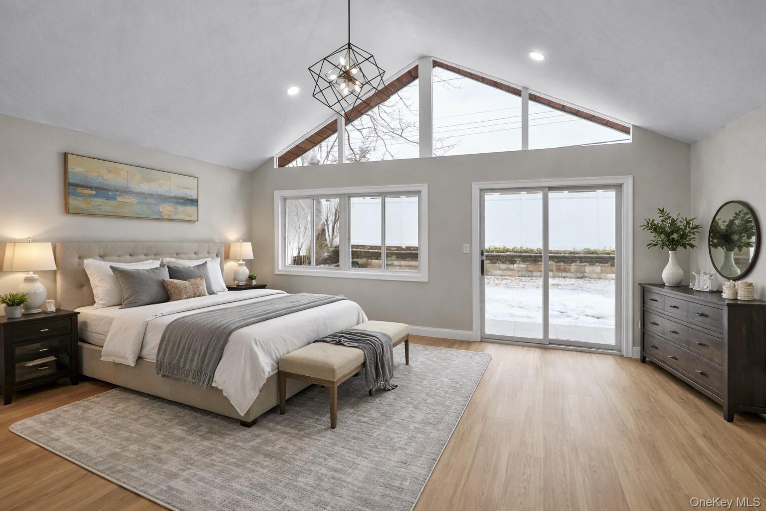 45 Colony Lane Syosset, NY 11791 - Photo 5 of 23 a spacious bedroom with a large bed and a window