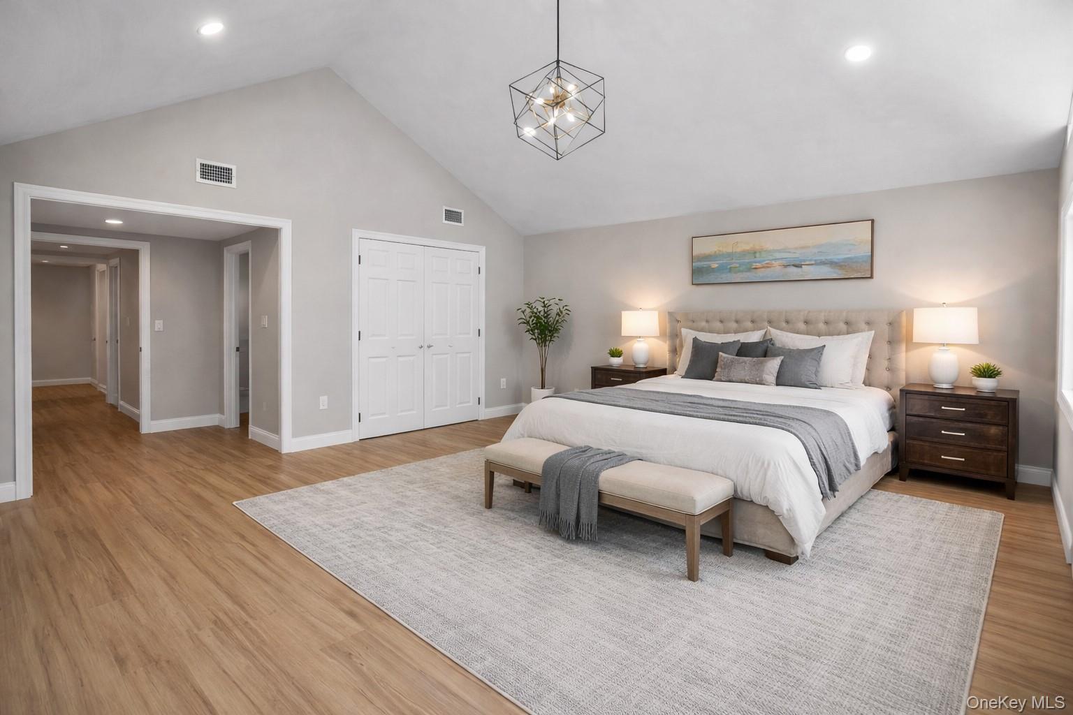 45 Colony Lane Syosset, NY 11791 - Photo 6 of 23 a spacious bedroom with a bed and wooden floor