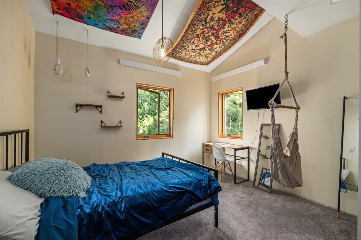 29195 River Drive Clark, CO 80428 - Photo 19 of 36 a bedroom with a bed dresser and a window