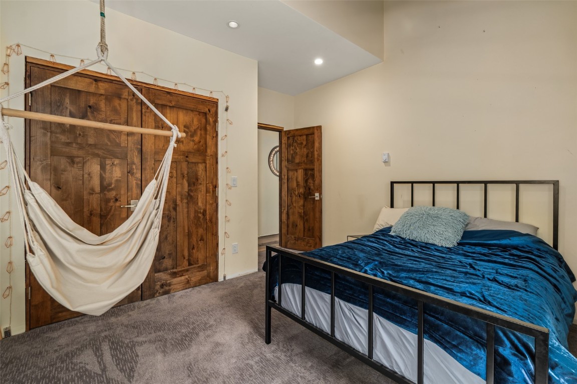 29195 River Drive Clark, CO 80428 - Photo 20 of 36 a bedroom with a bed and a mirror