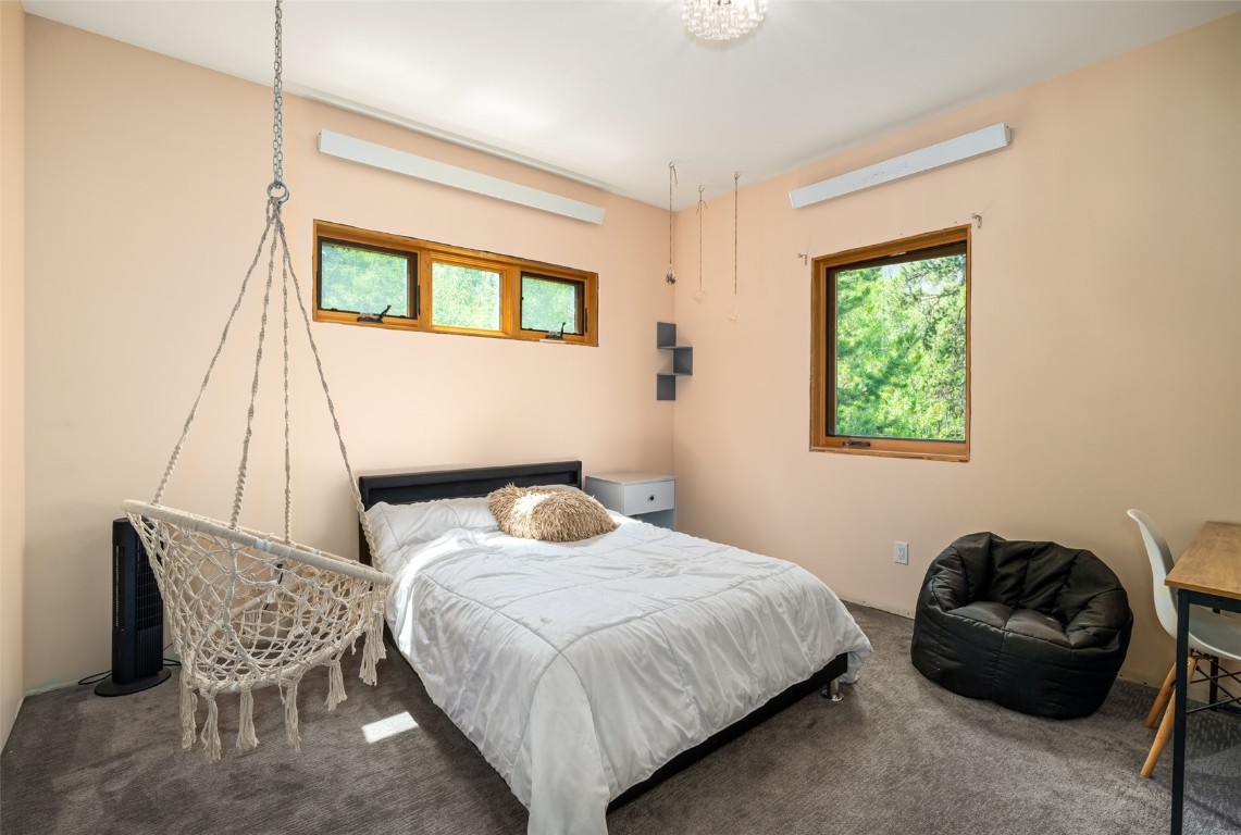 29195 River Drive Clark, CO 80428 - Photo 22 of 36 a bedroom with a bed and a window