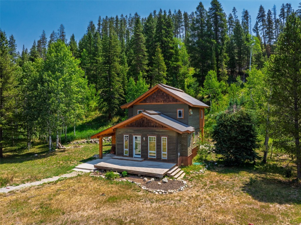 29195 River Drive Clark, CO 80428 - Photo 26 of 36 a house with trees in the background