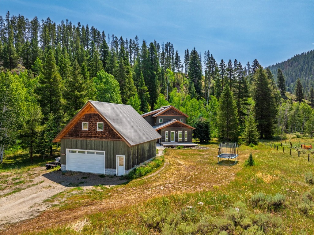 29195 River Drive Clark, CO 80428 - Photo 29 of 36 a view of a house with pool and a yard