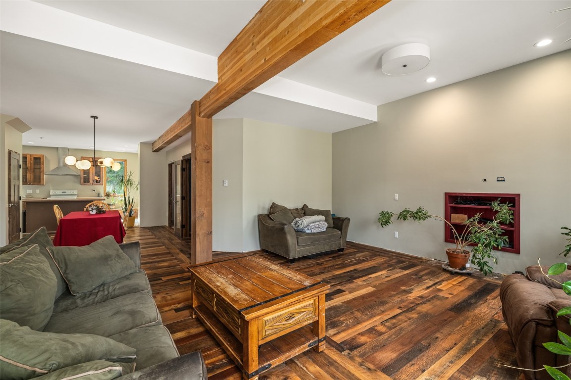 29195 River Drive Clark, CO 80428 - Photo 5 of 36 a bedroom with a bed and a chandelier