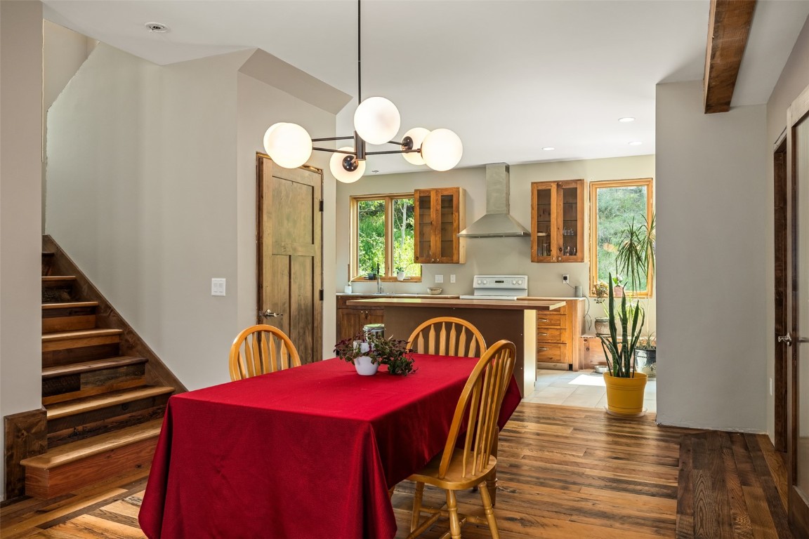 29195 River Drive Clark, CO 80428 - Photo 7 of 36 a view of a dining room with furniture wooden floor and chandelier