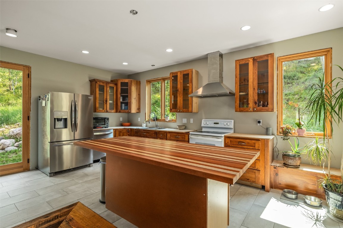 29195 River Drive Clark, CO 80428 - Photo 9 of 36 a kitchen with stainless steel appliances granite countertop a refrigerator and a sink