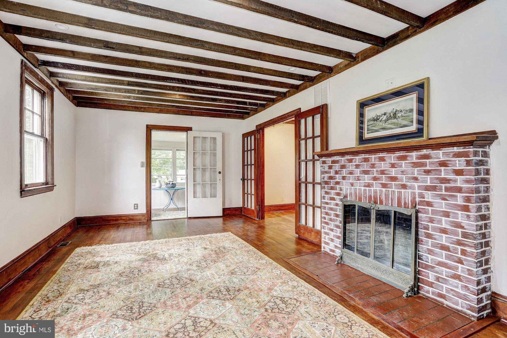 11858 Frederick Road Ellicott City, MD 21042 - Photo 4 of 35 Living room with wood burning fireplace