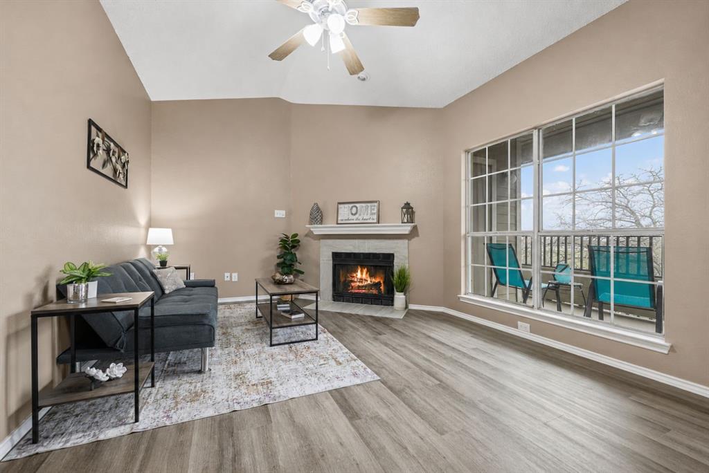 4113 Esters Road, Unit 609 Irving, TX 75038 - Photo 10 of 18 a living room with furniture and a fireplace
