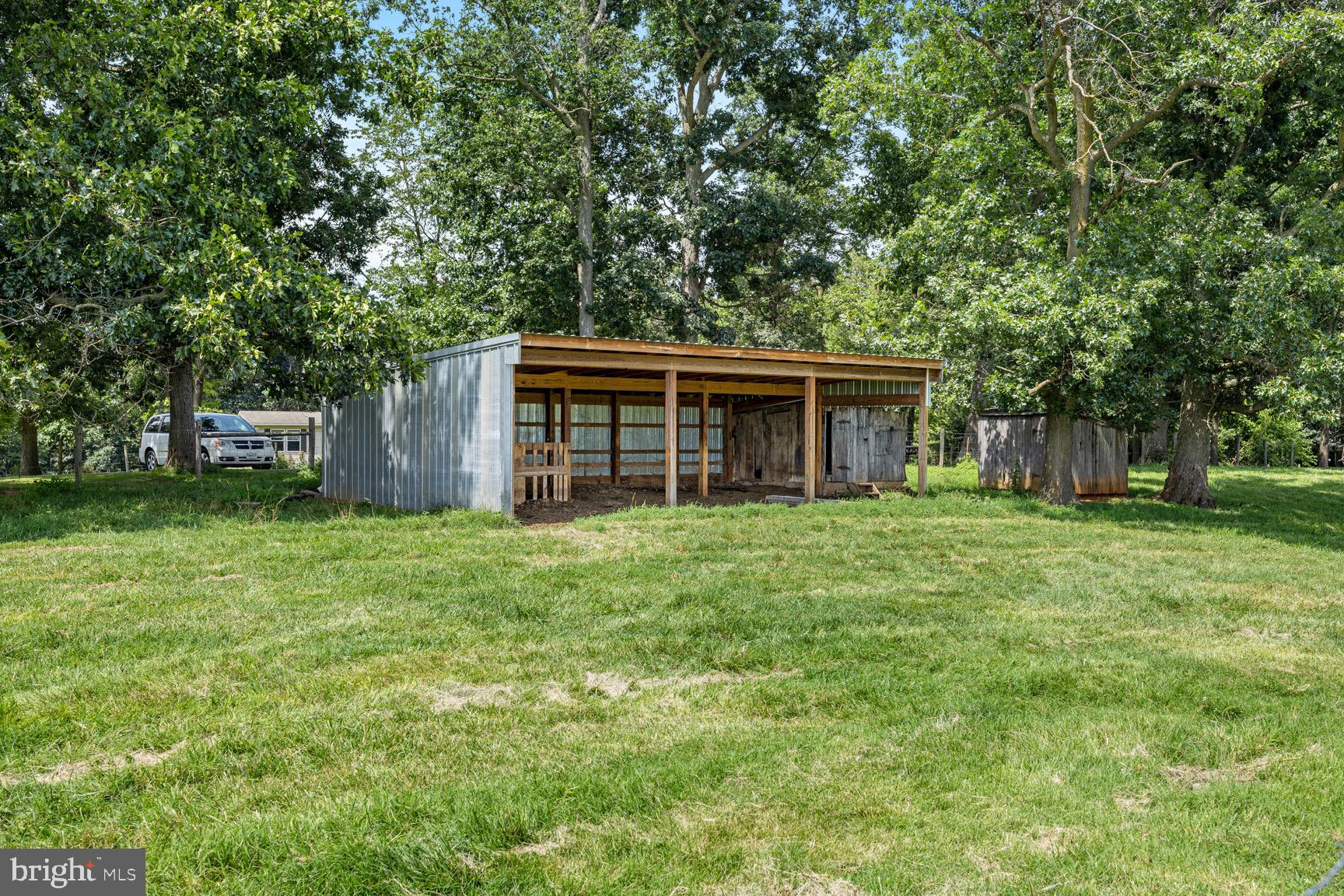 1275 Georgetown Road Mount Jackson, VA 22842 - Photo 13 of 45 a view of a house with backyard and a garden