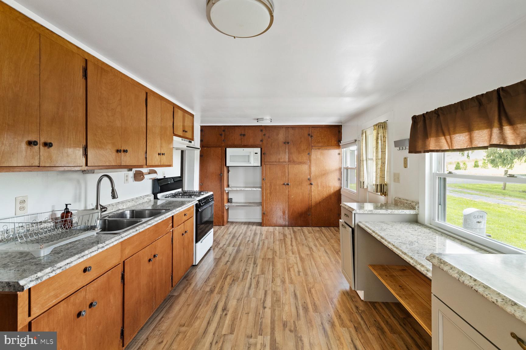 1275 Georgetown Road Mount Jackson, VA 22842 - Photo 18 of 45 a large kitchen with stainless steel appliances granite countertop a lot of counter space and wooden floors