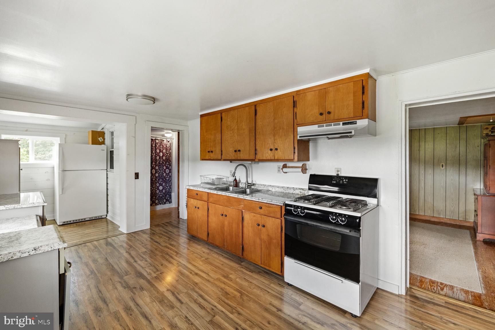 1275 Georgetown Road Mount Jackson, VA 22842 - Photo 21 of 45 a kitchen with stainless steel appliances granite countertop a stove cabinets and wooden floor