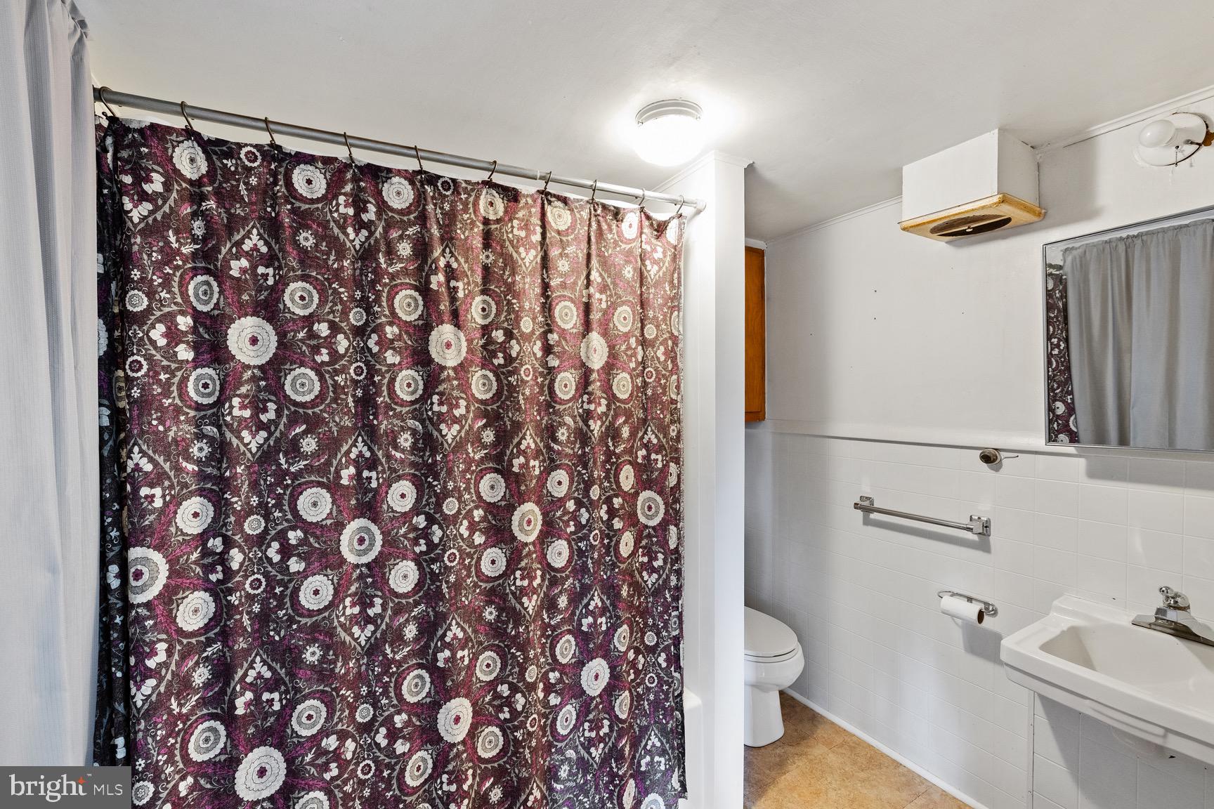 1275 Georgetown Road Mount Jackson, VA 22842 - Photo 22 of 45 a bathroom with a granite countertop sink toilet and shower