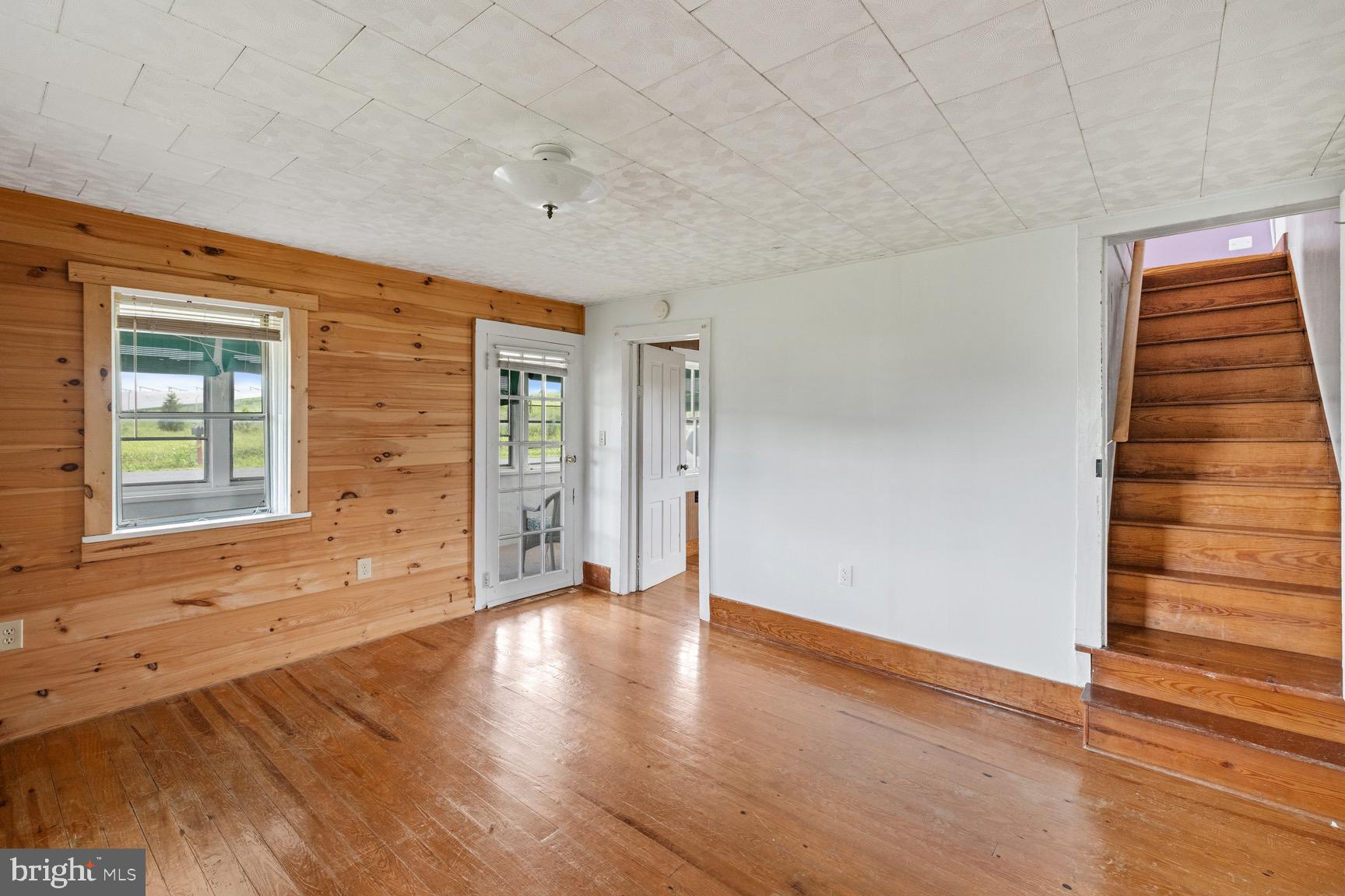 1275 Georgetown Road Mount Jackson, VA 22842 - Photo 27 of 45 a view of an empty room with wooden floor and windows