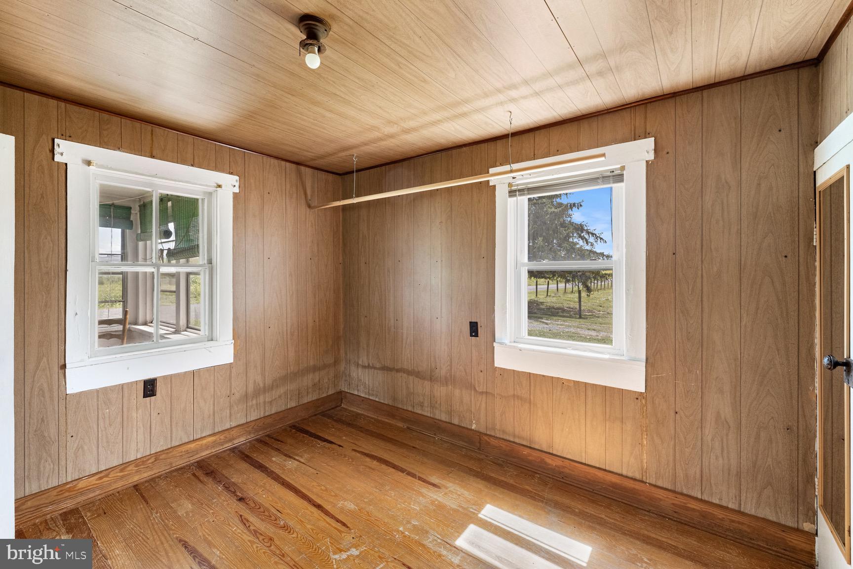 1275 Georgetown Road Mount Jackson, VA 22842 - Photo 34 of 45 an empty room with wooden floor and windows