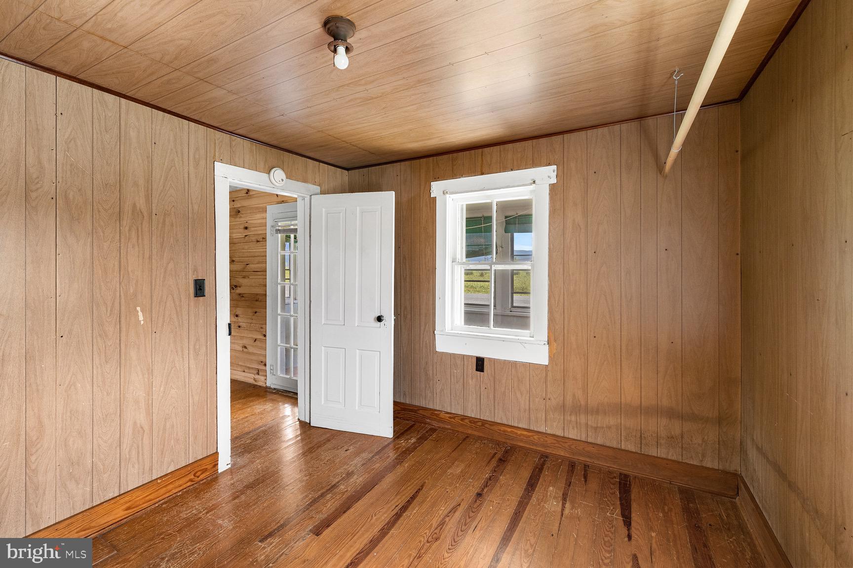 1275 Georgetown Road Mount Jackson, VA 22842 - Photo 35 of 45 an empty room with wooden floor and windows