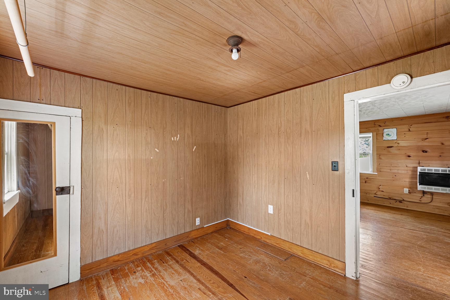 1275 Georgetown Road Mount Jackson, VA 22842 - Photo 36 of 45 a view of a hallway with wooden floor and dining room