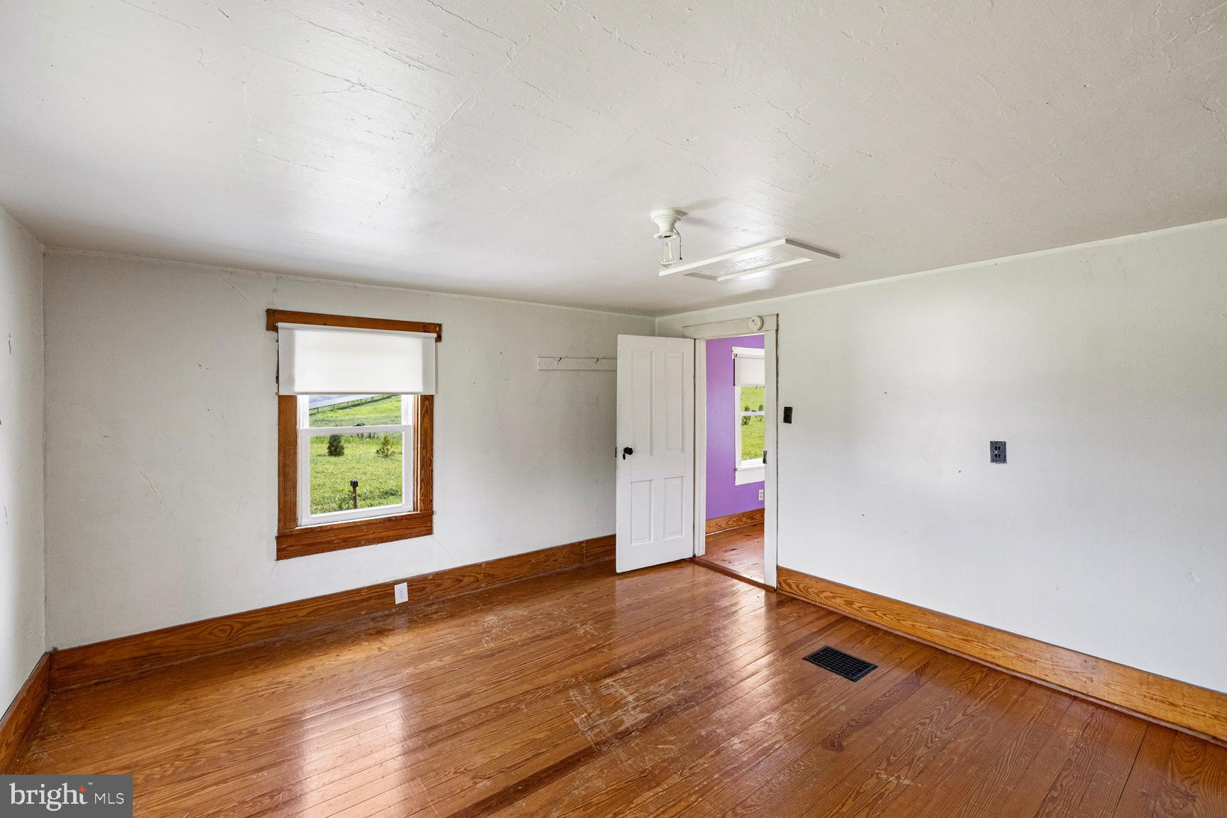 1275 Georgetown Road Mount Jackson, VA 22842 - Photo 38 of 45 an empty room with wooden floor and windows