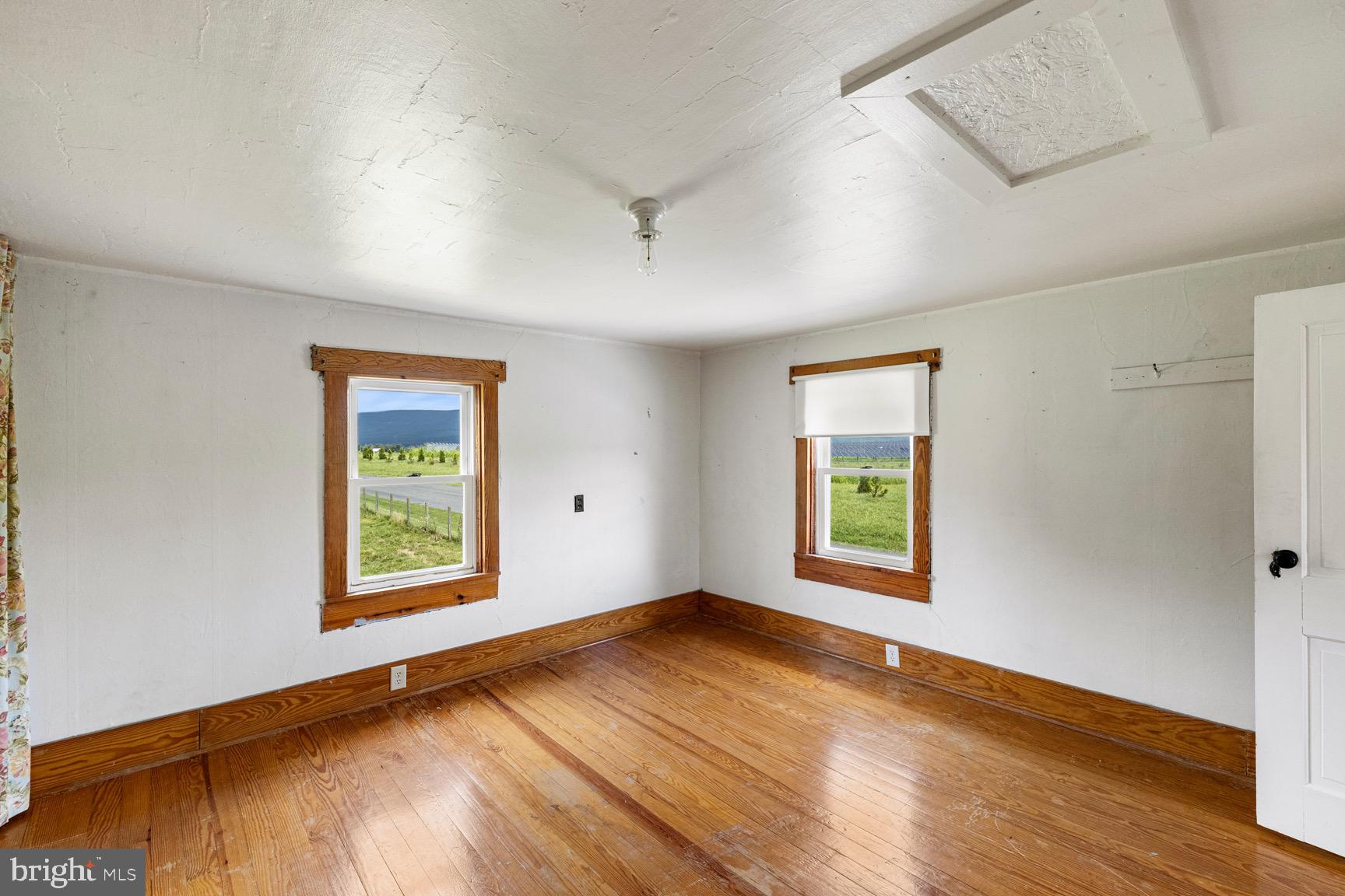 1275 Georgetown Road Mount Jackson, VA 22842 - Photo 39 of 45 an empty room with wooden floor and windows