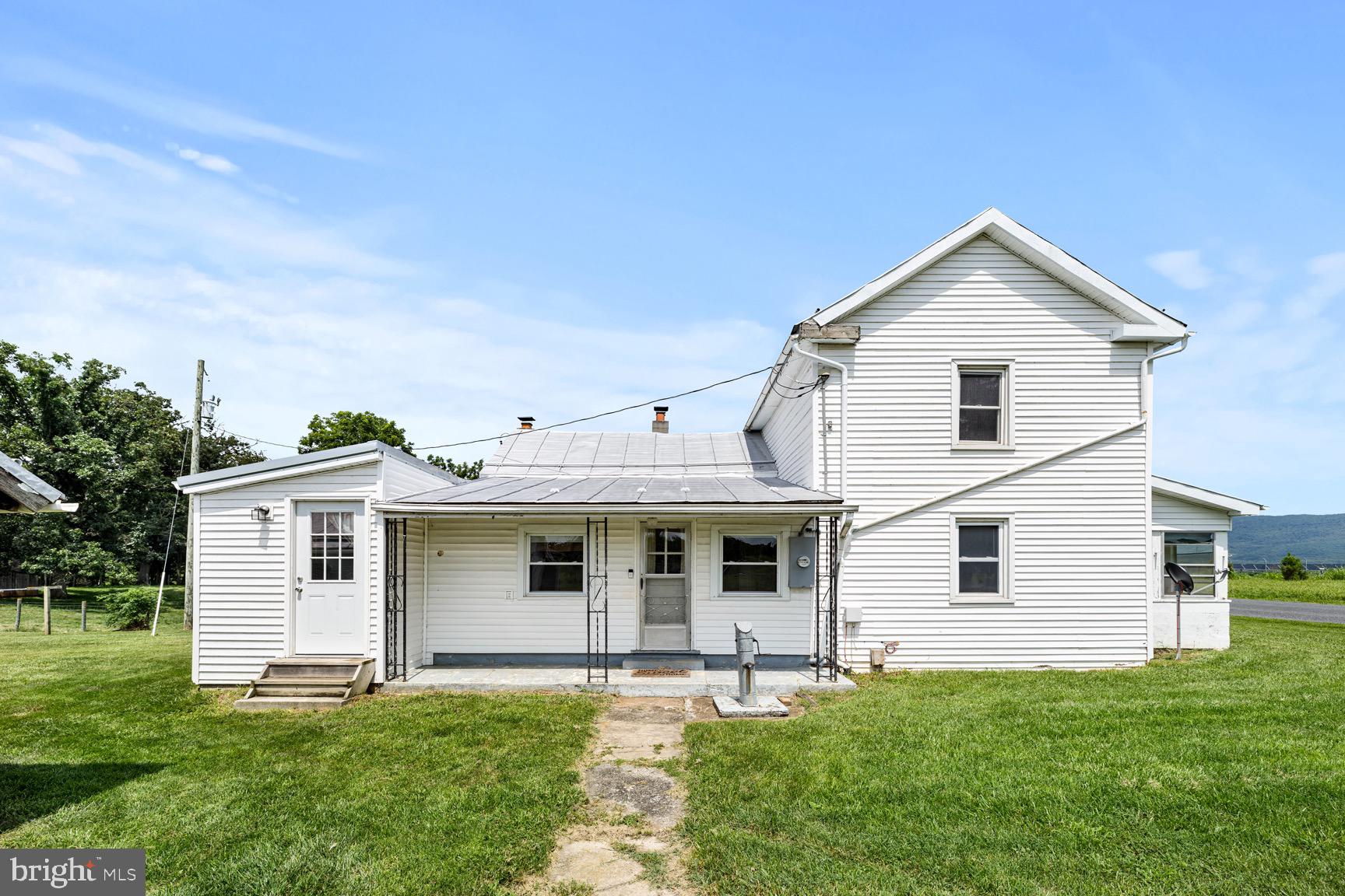 1275 Georgetown Road Mount Jackson, VA 22842 - Photo 7 of 45 a front view of a house with a yard and garage