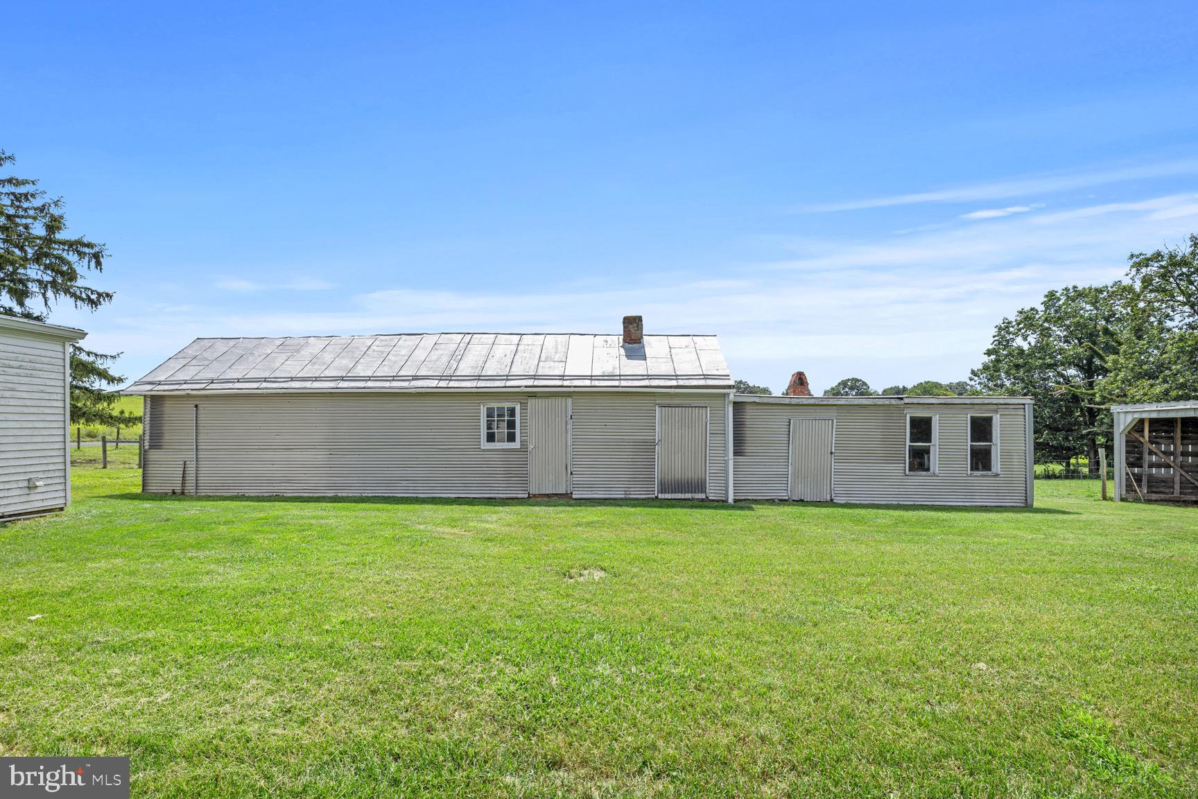 1275 Georgetown Road Mount Jackson, VA 22842 - Photo 10 of 45 a view of a house with a yard and a large tree