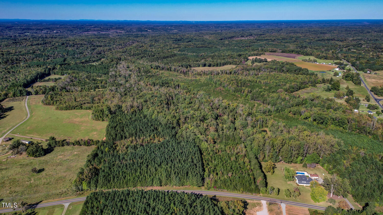 0 Cherry Grove Road Yanceyville, NC 27379 - Photo 2 of 9 a view of a lake with a mountain