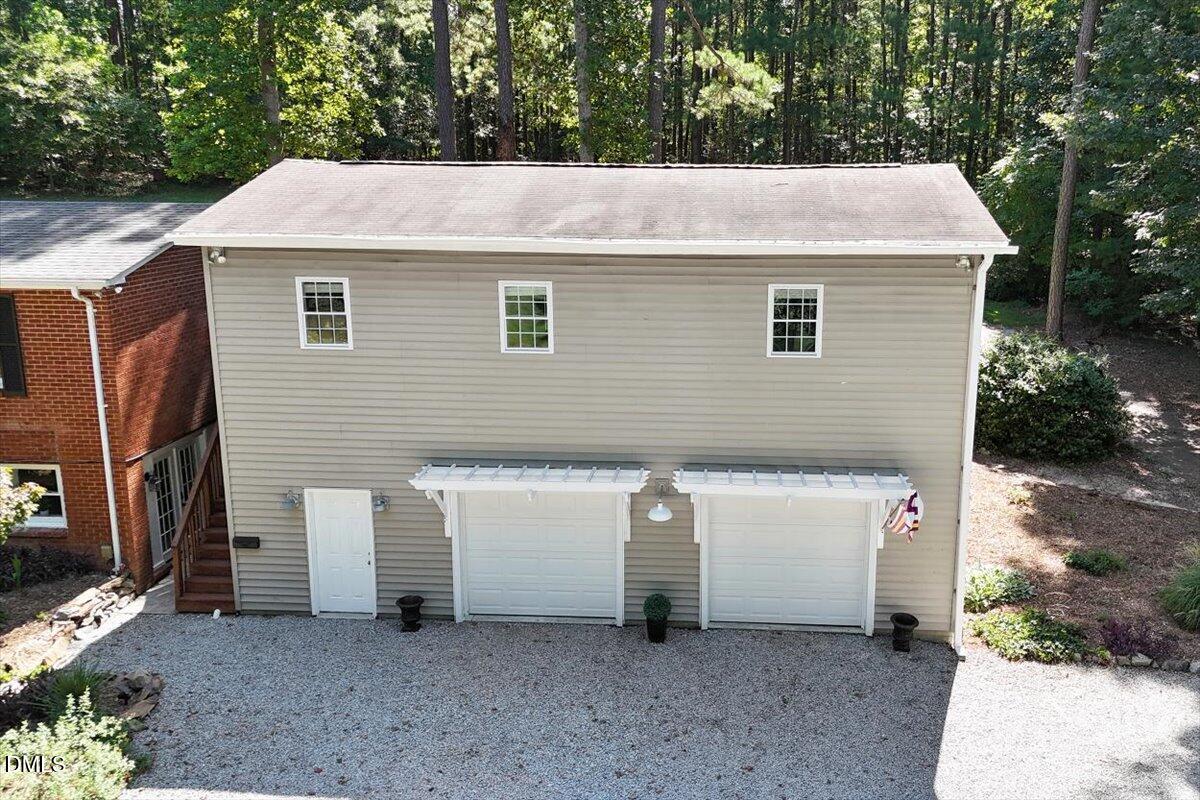 2129 Kelly Road Apex, NC 27502 - Photo 49 of 64 a aerial view of a house with yard and garage