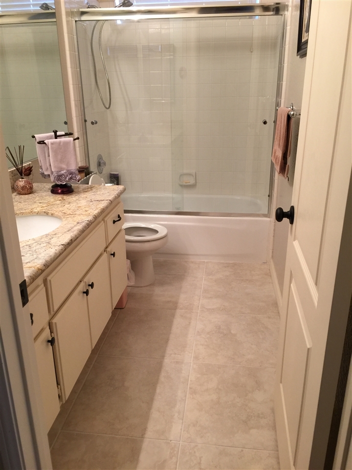 7591 Windy Ridge Road San Diego, CA 92126 - Photo 8 of 25 1st floor full bath next to the bedroom.