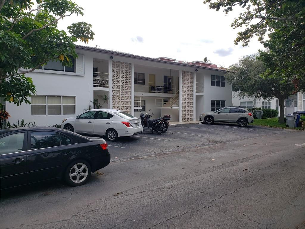 3212 Colony Club Road, Unit 2 Pompano Beach, FL 33062 - Photo 1 of 9 a view of a car parked in front of a house