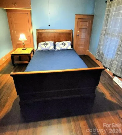 a room with furniture and wooden floor