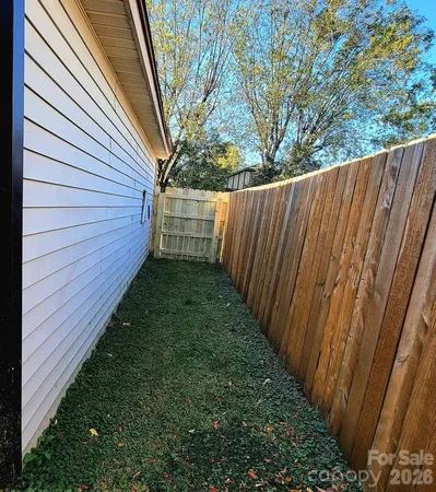 a view of a backyard with pathway