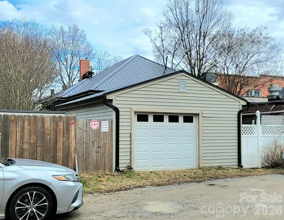 a front view of a house with parking space