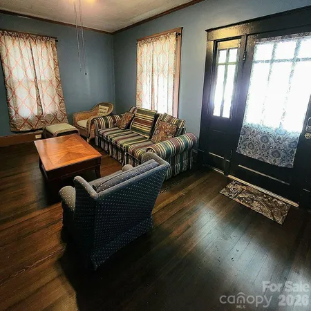 a bedroom with furniture and window