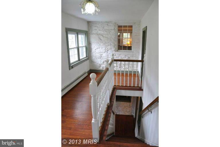 7431 Green Valley Road Frederick, MD 21701 - Photo 12 of 30 Hallway Stairwell with Sitting Area