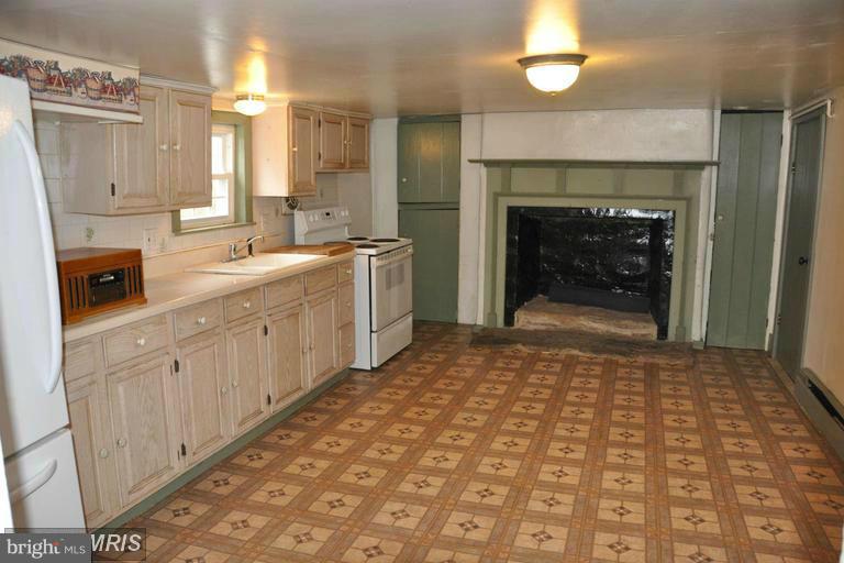 7431 Green Valley Road Frederick, MD 21701 - Photo 4 of 30 Kitchen with Fireplace