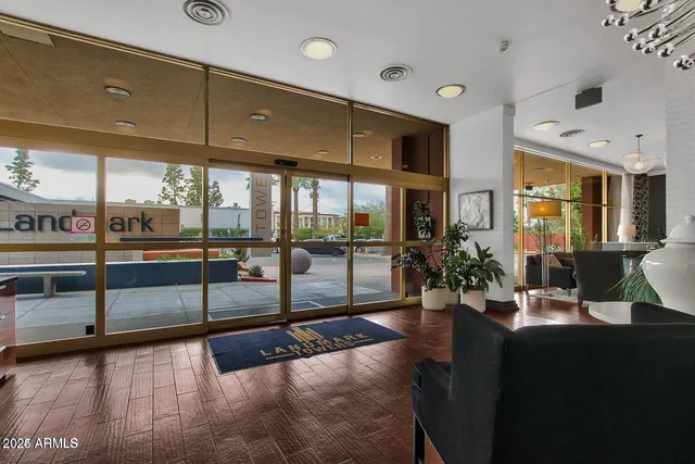 a lobby with furniture and window