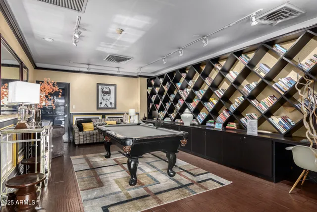 a room with gym equipment and a rug