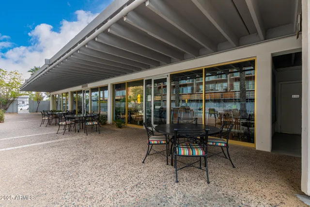 a view of a storage room with a table and chairs