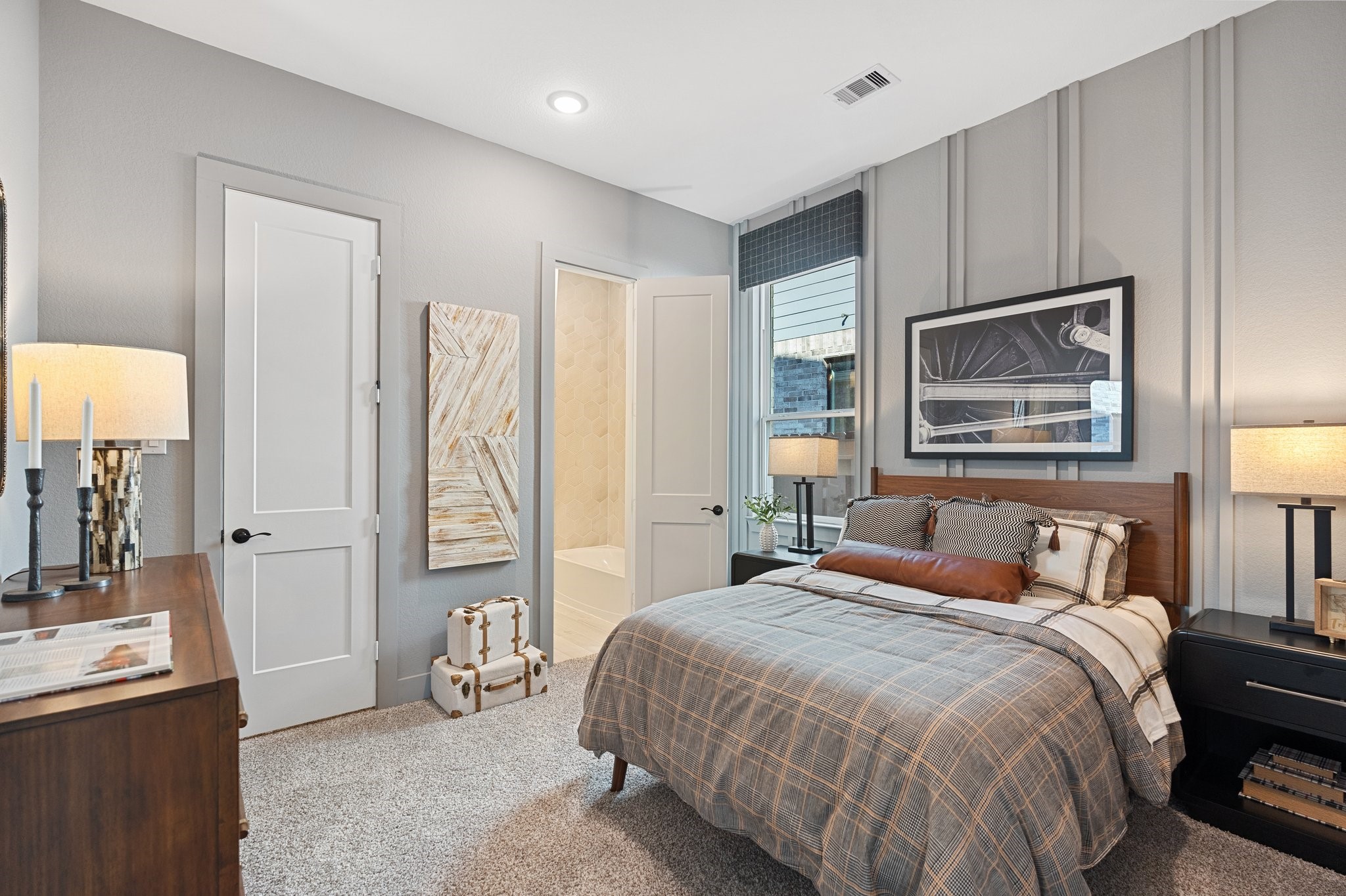 327 Afton Drive Rosenberg, TX 77471 - Photo 22 of 48 a bedroom with a large bed and a chandelier