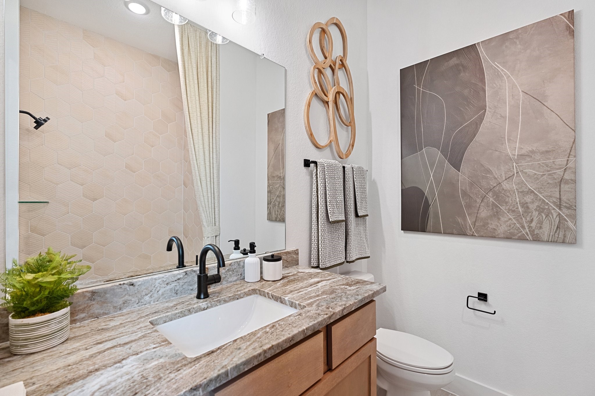 327 Afton Drive Rosenberg, TX 77471 - Photo 24 of 48 a bathroom with a granite countertop sink a toilet and a mirror