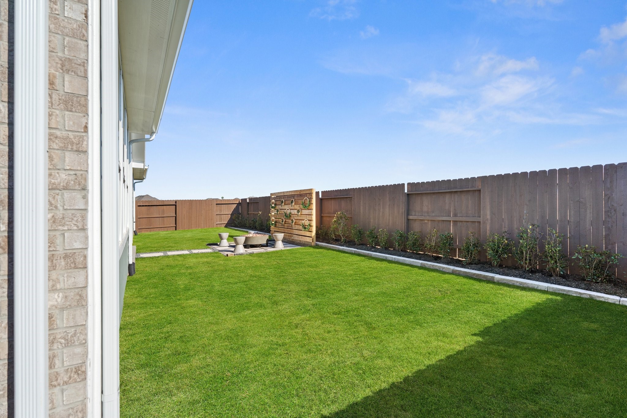 327 Afton Drive Rosenberg, TX 77471 - Photo 46 of 48 a view of a backyard with potted plants and wooden fence