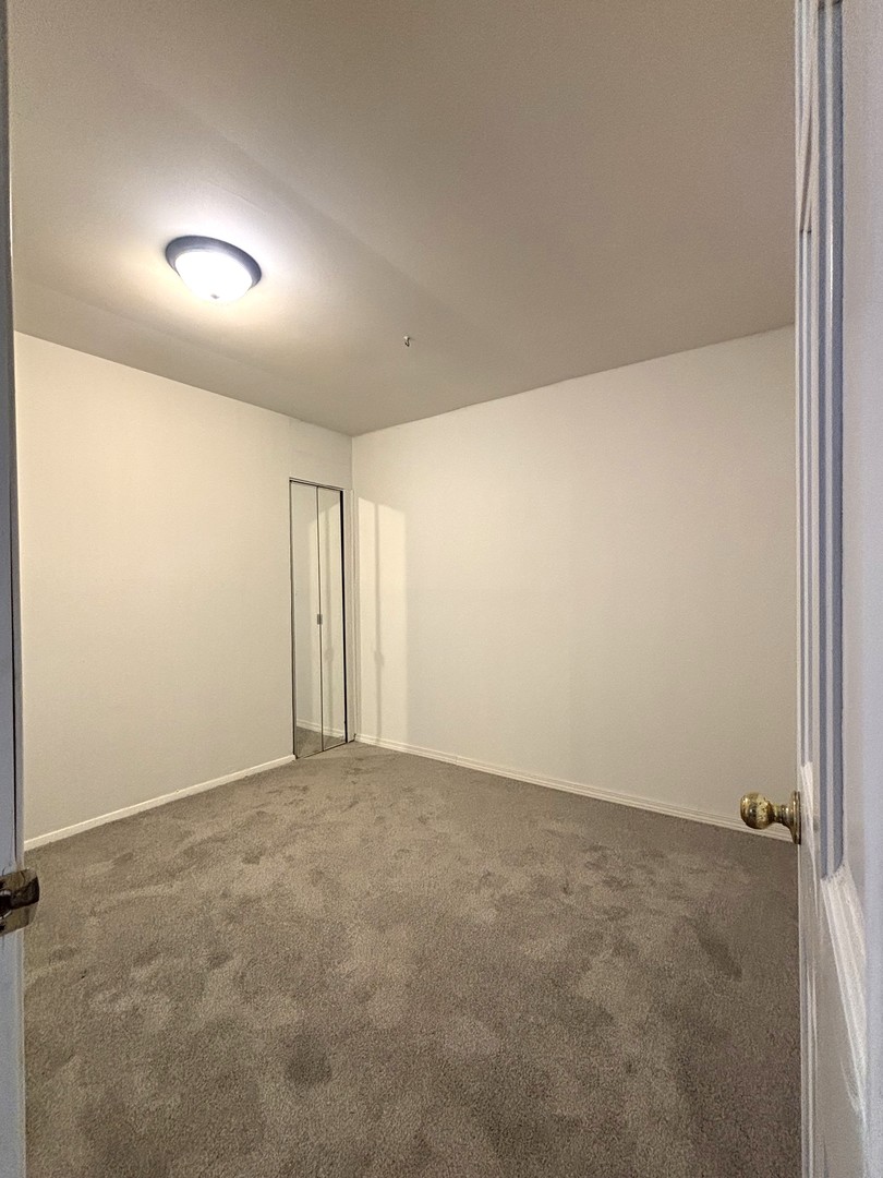22 Guilford Road Montgomery, IL 60538 - Photo 9 of 14 an empty room with an entryway