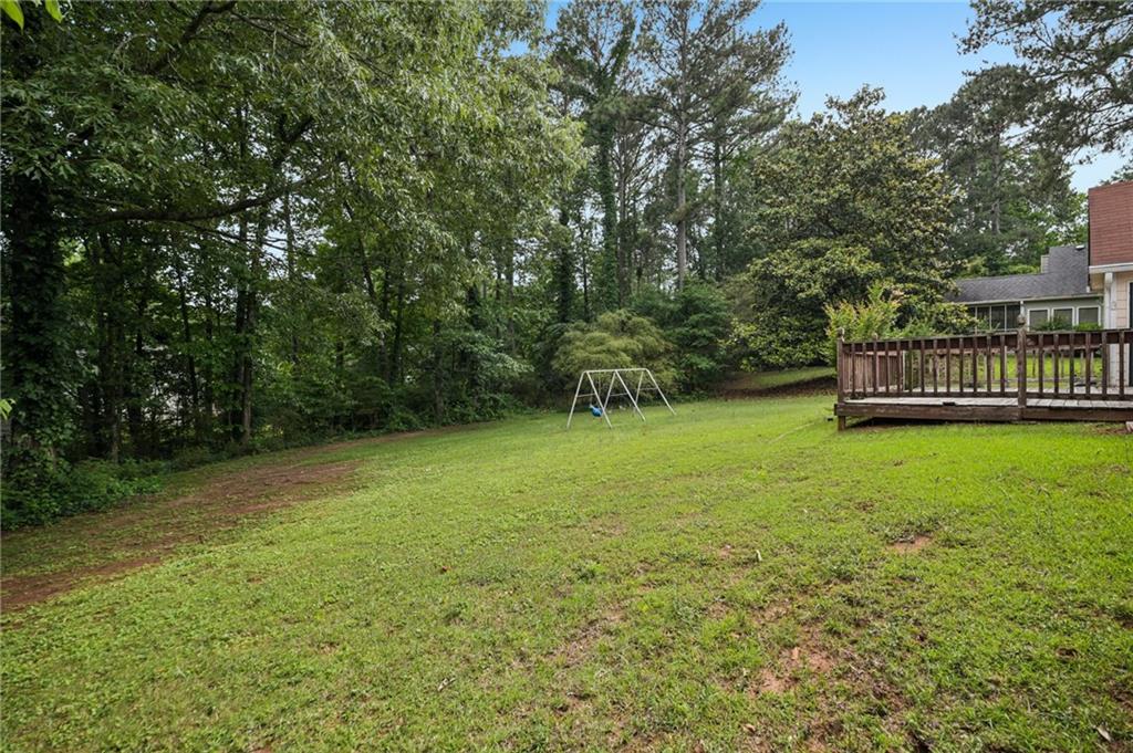 1318 Panhandle Way Hampton, GA 30228 - Photo 21 of 22 a view of a garden with a trees