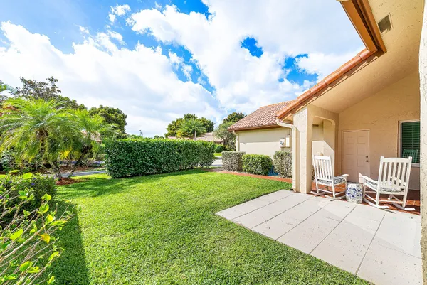 an aerial view of a house with a swimming pool yard and outdoor seating