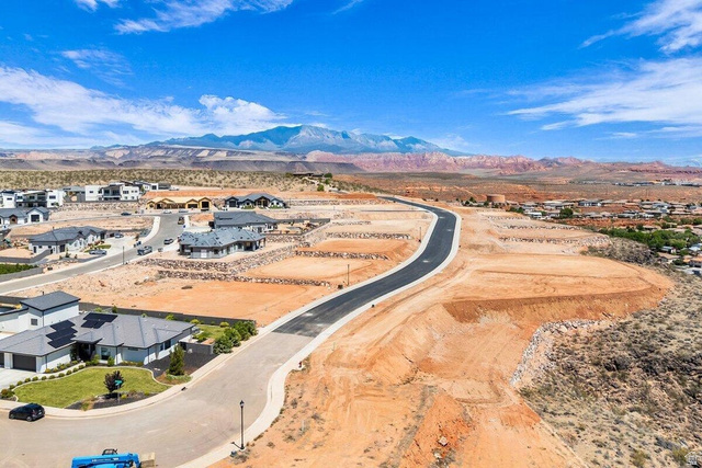 Undisclosed Address St. George, UT 84770 - Photo 1 of 11 Spacious desert landscape with paved roads, established residential areas, and distant mountainous terrain