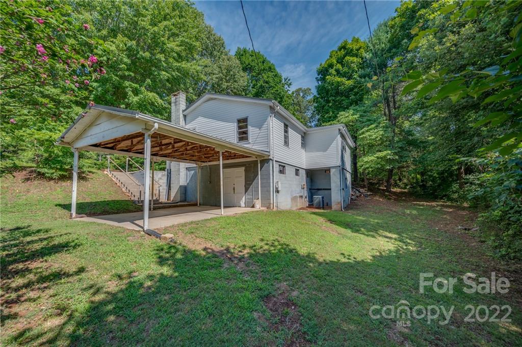 4580 Hudlow Road Rutherfordton, NC 28139 - Photo 7 of 32 a white house sitting in middle of the forest