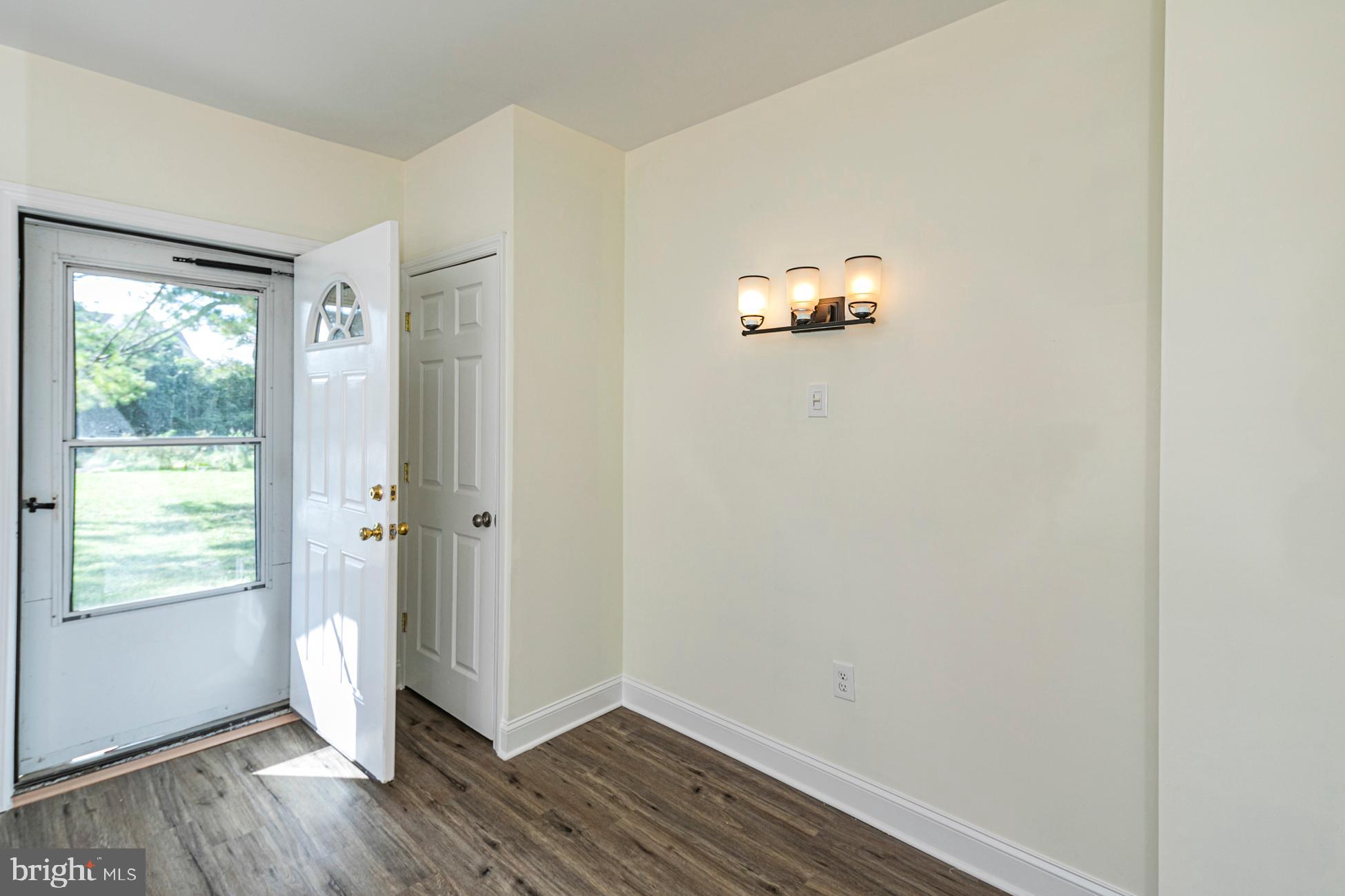 166 John Street Princeton, NJ 08540 - Photo 11 of 29 a view of an empty room with wooden floor and a window