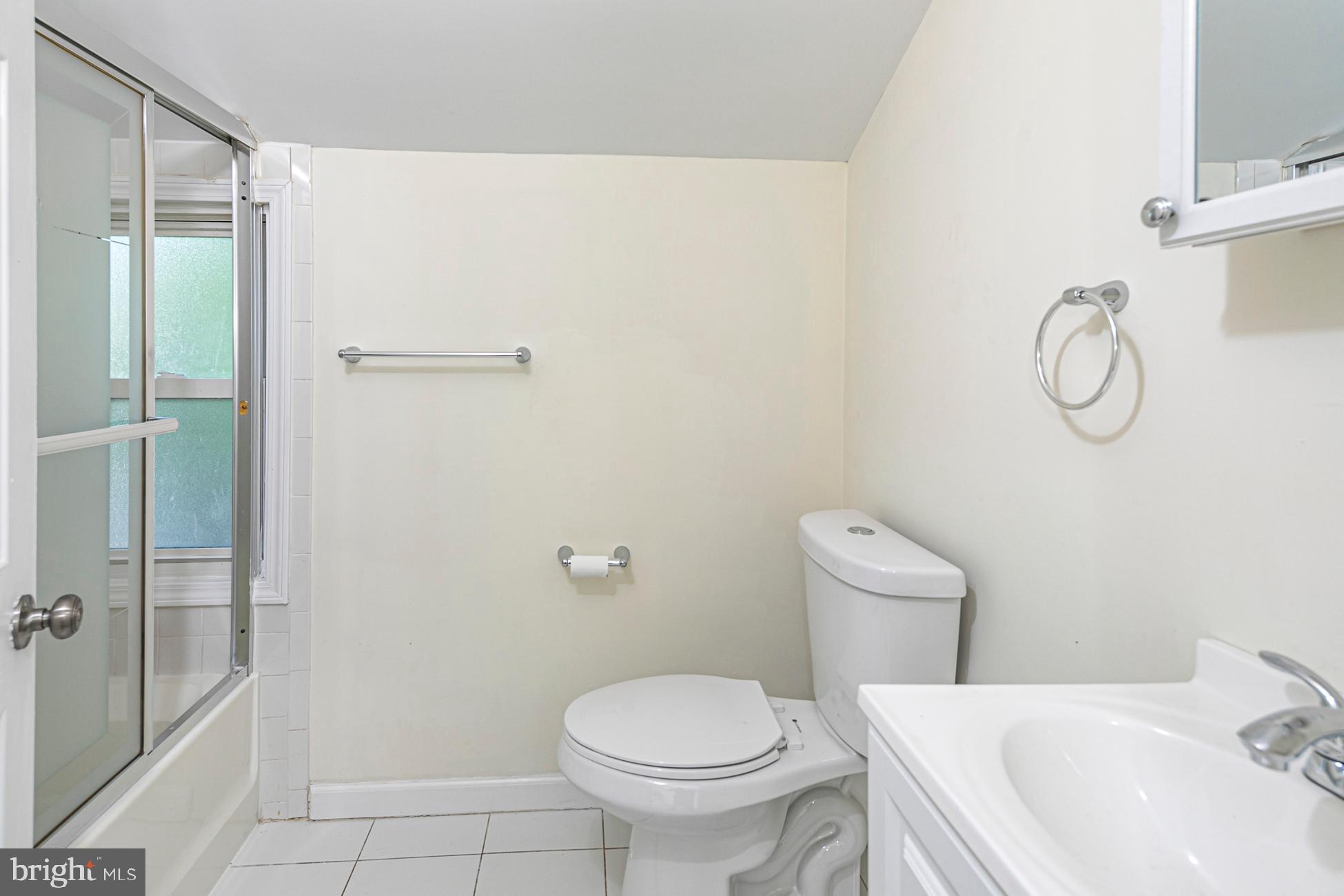 166 John Street Princeton, NJ 08540 - Photo 23 of 29 a white toilet sitting next to a bathroom sink