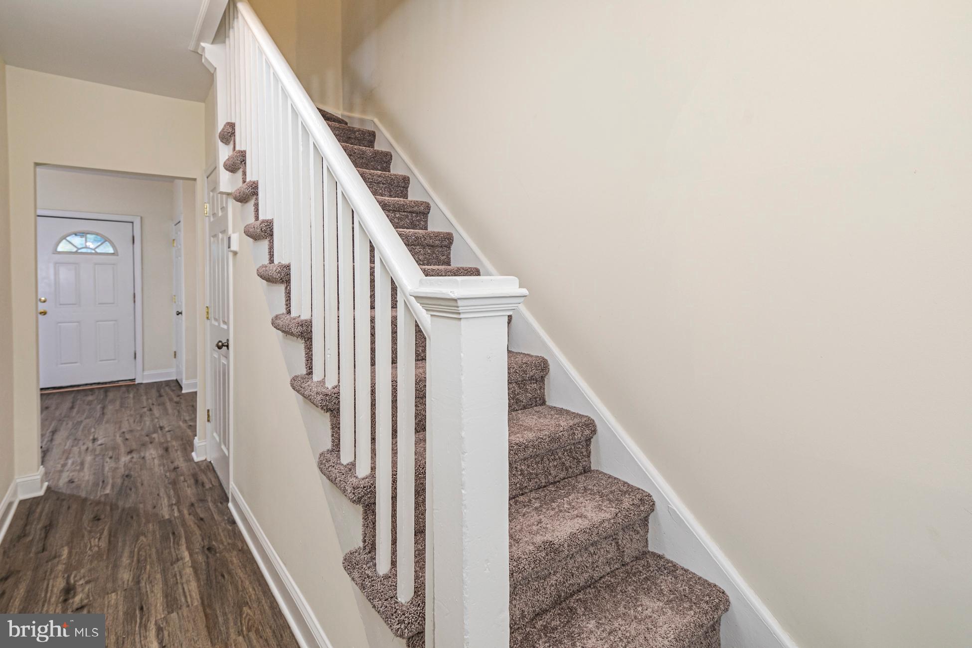 166 John Street Princeton, NJ 08540 - Photo 5 of 29 a view of a hallway with wooden floor and staircase